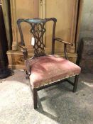 A George III mahogany Chippendale style open armchair, the moulded top rail above an intricately