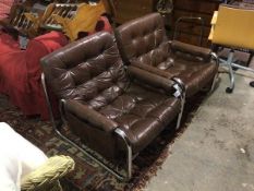 A pair of 1960s/70s sling chairs on tubular metal frames, in buttoned chocolate brown leather,