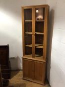 A Hans Elleflaadt (c.1948-89), oak standing corner cabinet, the upper section fitted a pair of
