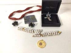 A collection of costume jewellery including a paste pearl bracelet (18cm), a polished stone