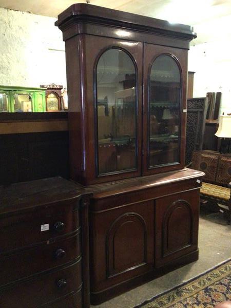 A large Victorian mahogany bookcase, the moulded cornice above two glazed doors (one a/f)