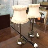 A pair of table lamps with ruffled shades, lustres, on straight supports and circular bases (to