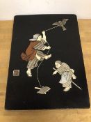A Japanese black lacquer panel, c.1900, with mother of pearl, wood and ivory figures and bird,