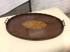 An Edwardian oval drinks tray with raised scalloped edge and raised handles to sides (62cm x 38cm)