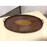 An Edwardian oval drinks tray with raised scalloped edge and raised handles to sides (62cm x 38cm)