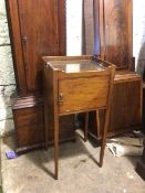 A 19thc mahogany bedside table, with galleried top above a single cupboard door, on tapering