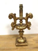 A composition table lamp in the rococo taste, gilt on square base (36cm)