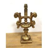 A composition table lamp in the rococo taste, gilt on square base (36cm)