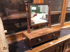 A 19thc mahogany dressing table mirror, the rectangular glass on turned supports, the base fitted