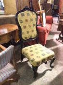 A Louis XV style ebonised side chair with upholstered back and seat, with flag decoration, on