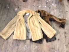 A fur coat, bears label AE Ball, George Street, Edinburgh (37cm across shoulders) and another fur
