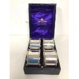 A set of four Edwardian London silver Mappin & Webb napkin rings, two inscribed, I and II, the other