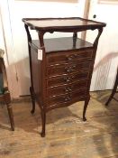 A reproduction Edwardian style sheet music cabinet, with upper tier, the top with raised