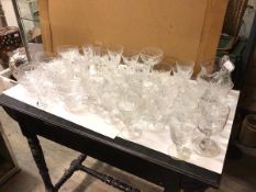 A large quantity of glassware including cut glass wine glasses, sherry glasses, fruit bowls,