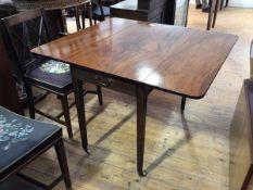 An early 19thc mahogany pembroke table, the rectangular top with two drop leaves, rounded corners,