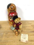 A Hermann Matryoshka mohair bear, a three piece Matryoshka set with two wooden nesting dolls (
