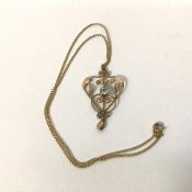 An Edwardian 9ct gold pendant and chain, the pendant of heart shape with central aquamarine stone