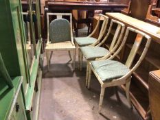 A set of four painted faux bamboo side chairs, with solid splats above cane seats and seat cushions,