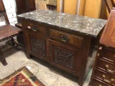 A side cabinet with rectangular marble top above two drawers with walnut veneer and two panel doors,