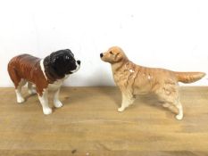 Two Beswick dogs, including a Saint Bernard, one paw inscribed Corna Garth Stroller and the other