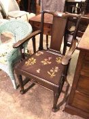 A 19thc mahogany side chair, with yoke top rail above solid splat, with floral grospoint drop in