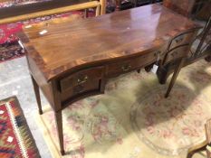 A 1930s/40s mahogany Georgian style sideboard, the crossbanded serpentine top above an arrangement