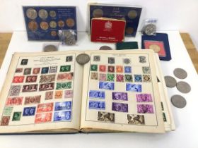 A mixed lot including a stamp album with British and International stamps, a quantity of