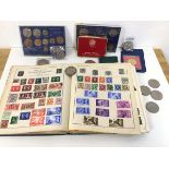 A mixed lot including a stamp album with British and International stamps, a quantity of