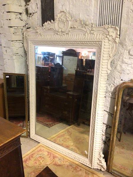 A large 19thc/early 20thc overmantel mirror, the rectangular glass within an intricate frame, with C