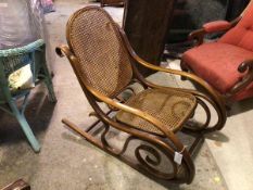 A 1930s/40s bentwood rocking chair with cane back and seat (85cm x 50cm x 103cm)