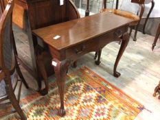 A Georgian style side table, the rectangular top above a single frieze drawer, on cabriole