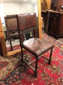 A 17thc style chair with leather upholstered and studded back with griffon relief, with matching