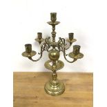 A Dutch style candelabra with a central candleholder, above four scroll arms ending in