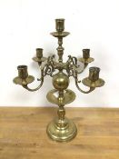 A Dutch style candelabra with a central candleholder, above four scroll arms ending in