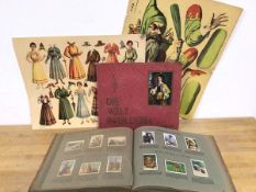 Two cigarette card albums both entitled Die Welt In Bildern and two reproduction prints of vintage