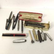 A quantity of vintage pens and pencils and penknives, some with mother of pearl cases (a lot)