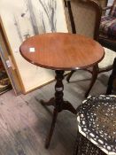 A latter half of the 20thc circular occasional table, the top with moulded edge on turned tripod