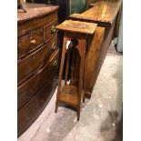 An Edwardian plant stand with square top above a pierced apron, on angled supports united by