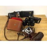 Photography interest: two Kodak brownies, a further camera and a Zeiss Ikon Contessa and a pair of