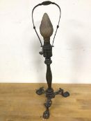 An early 20thc Pulman table lamp with a glass flame bulb (48cm to top of shade support)