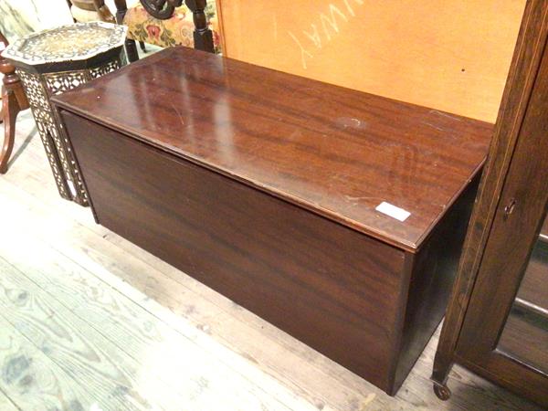 A Legate Furniture teak chest with hinged top and unfitted interior, bears labels for Martin &