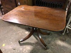 An early 20thc mahogany Georgian style tilt top table, with crossbanded edge on four footed