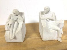 A pair of Marbell Stone Art Belgium bookends, male and female seated figures (a/f)