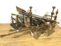 A quantity of brassware including four sets of andirons, various fire tools, a Vono knife cleaner (