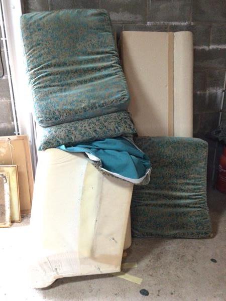 A modern two seater sofa in mottled turquoise upholstery, unassembled (approx: 77cm x 225cm x