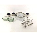 A mixed lot of silver and glass including a toastrack (63g), a cut glass ashtray with silver