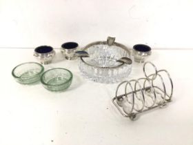 A mixed lot of silver and glass including a toastrack (63g), a cut glass ashtray with silver