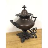 An early 20thc hot water urn on foliate base, lid marked Warranted best London manufacture to