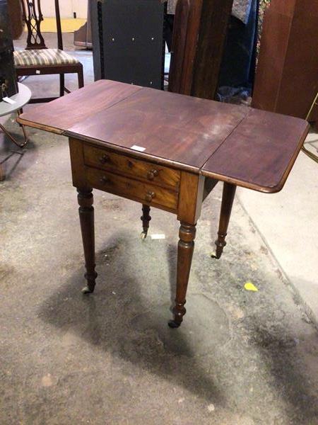 A Victorian mahogany work table, the top with two drop leaves to sides, with moulded edge above