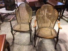 A pair of 1930s armchairs with cane back and seats, (cane to one a/f), on front cabriole supports